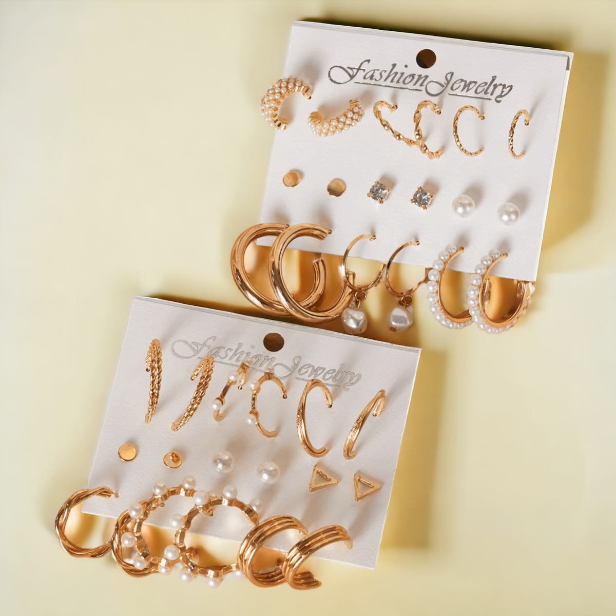 Elegant silver color butterfly and heart-shaped drop earrings set on a white background."