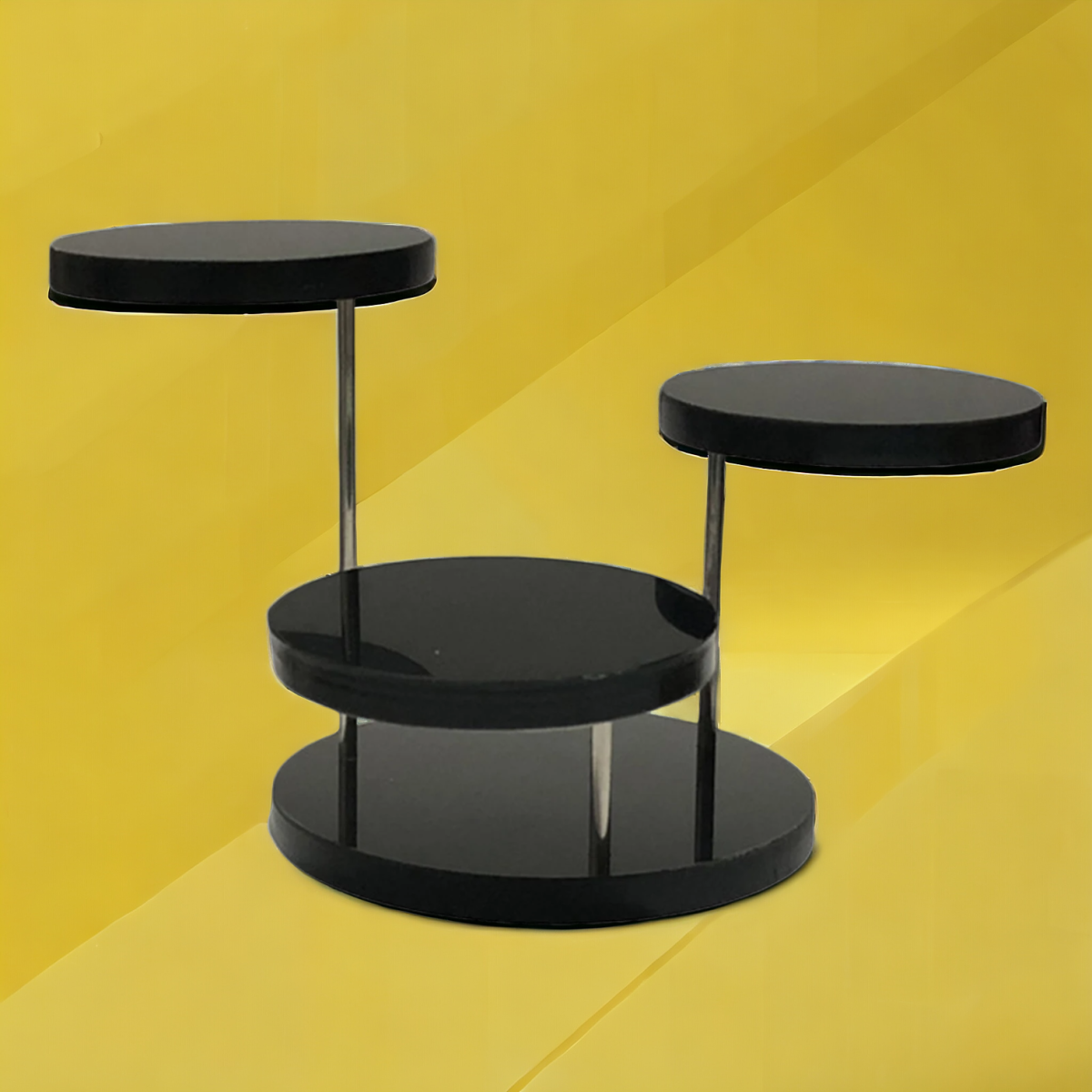 Black acrylic jewelry display stand with three rotating layers.