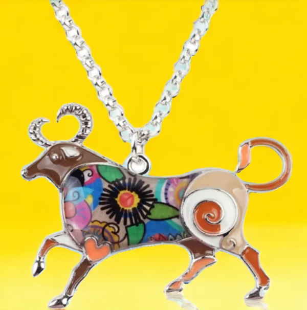 Close-up of SobPai Taurus Zodiac Necklace enamel bull pendant.