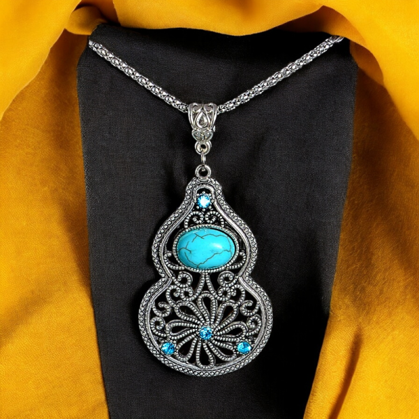 Close-up view of SobPai vintage blue stone necklace featuring a water drop crystal pendant