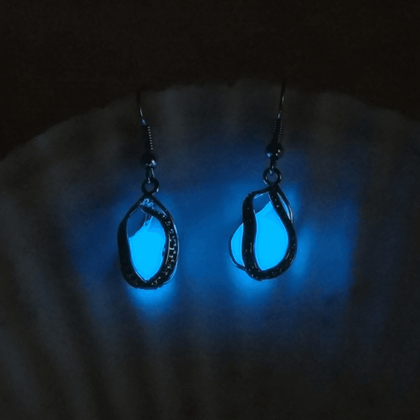 Front view of SobPai luminous blue glow earrings for women, made of premium alloy and glass.